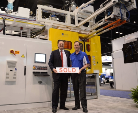 COO Patrick Lindsey with Graham CEO Dave Schroeder in front of a new mini Hercules