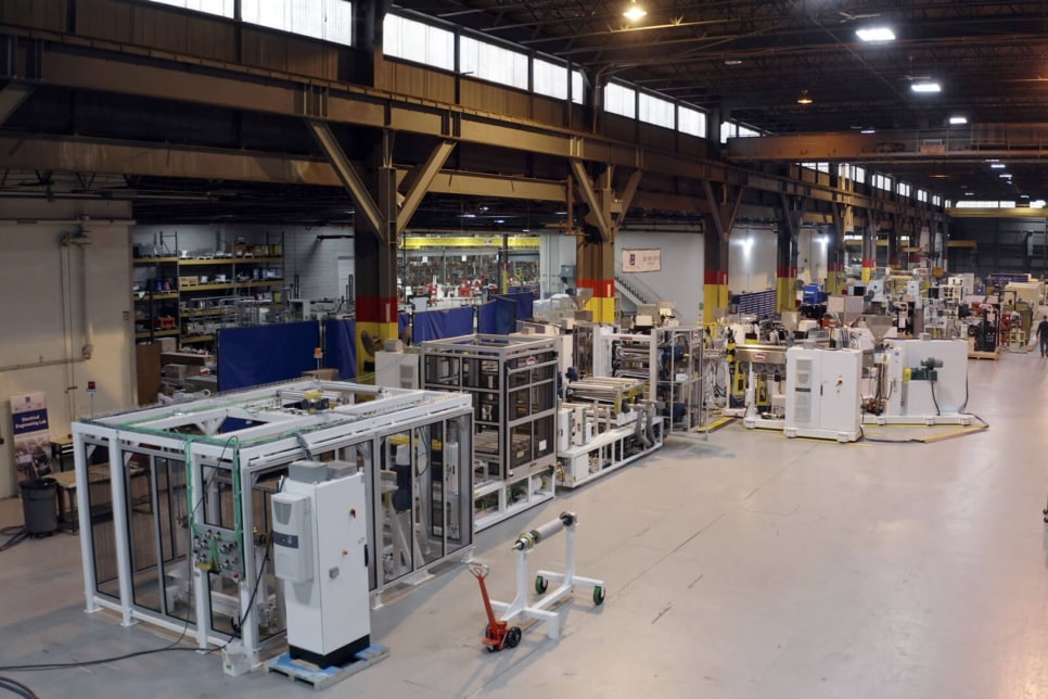 Extruder equipment pictured in a factory setting